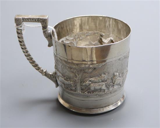 An Indian embossed white metal mug, stamped C. Krishniah Chetty, height 82mm.